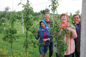 Anna , Bruce , Wilma, Director Anatoli, among 5,000 newly planted apple trees